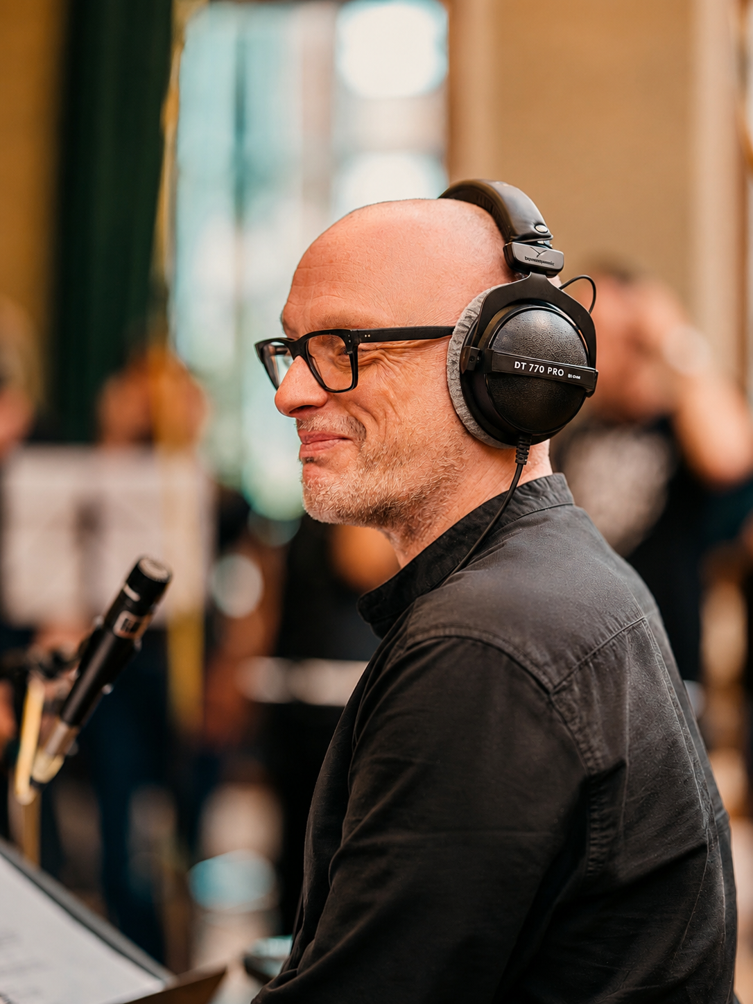 Andy Gilbert directing a SLYMI recording session