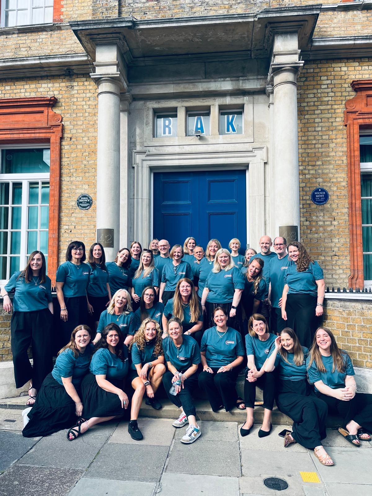Sing Like You Mean It choir together outside RAK Studios in London