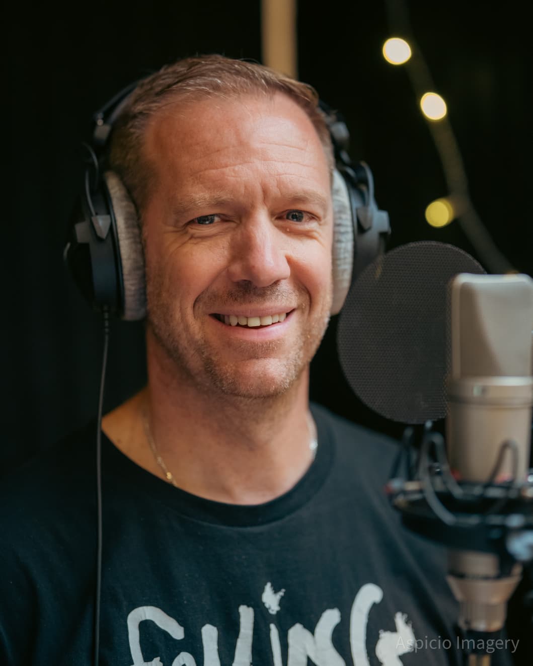 A SLYMI member recording vocals at RAK Studios in London