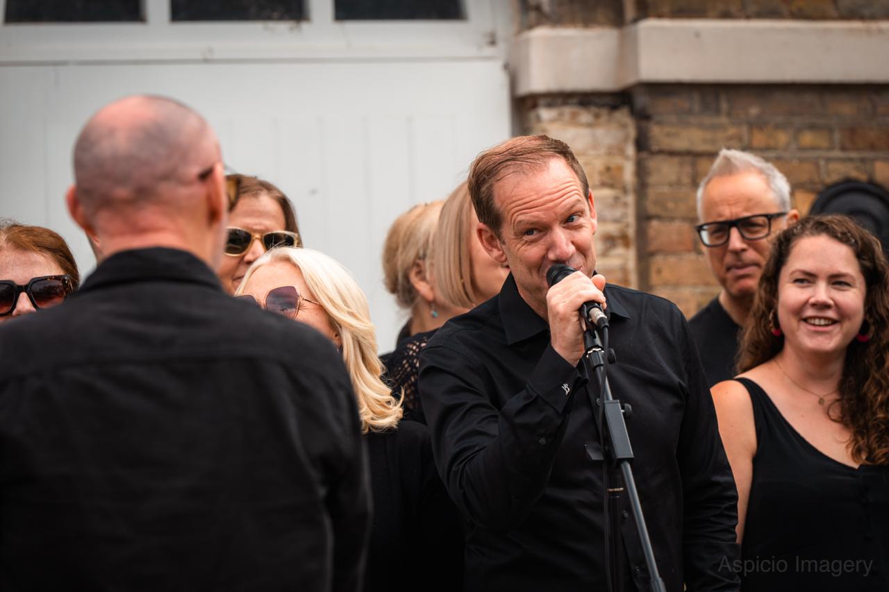 A SLYMI soloist singing live