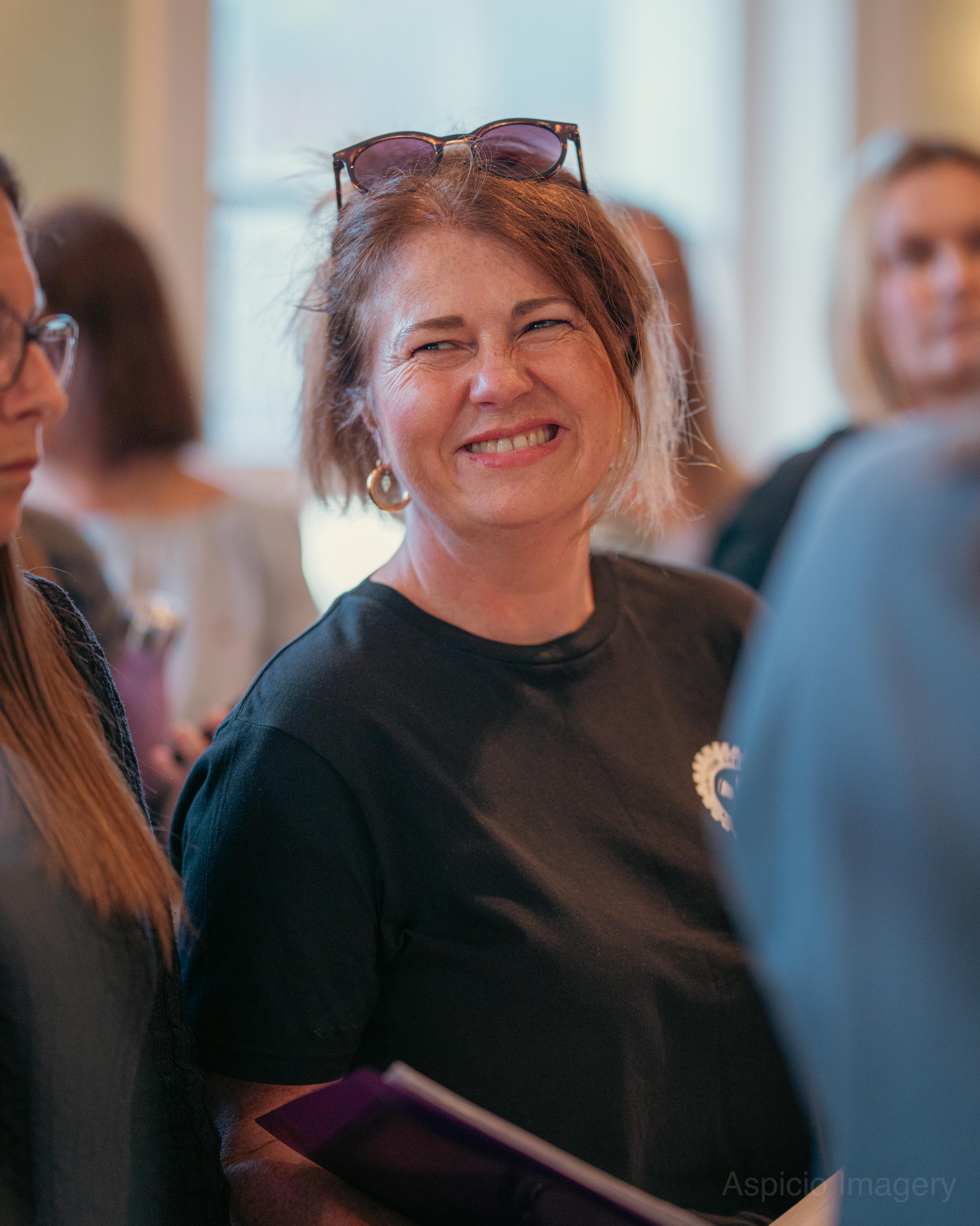 A smiling SLYMI choir member